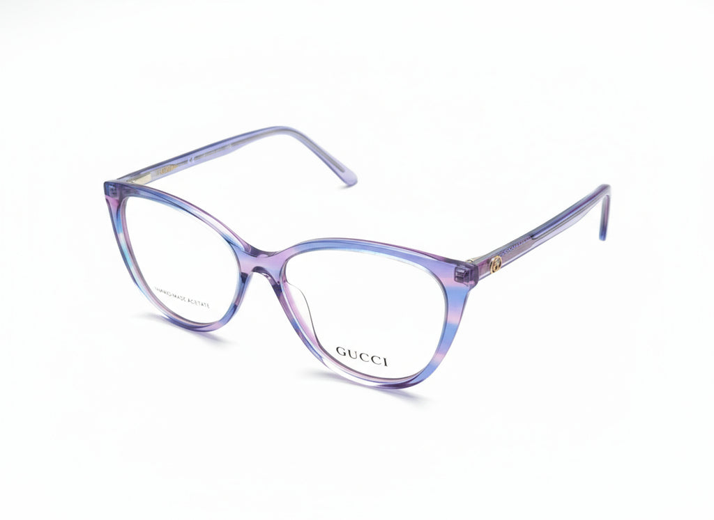 Purple Gucci eyeglasses on a gray background